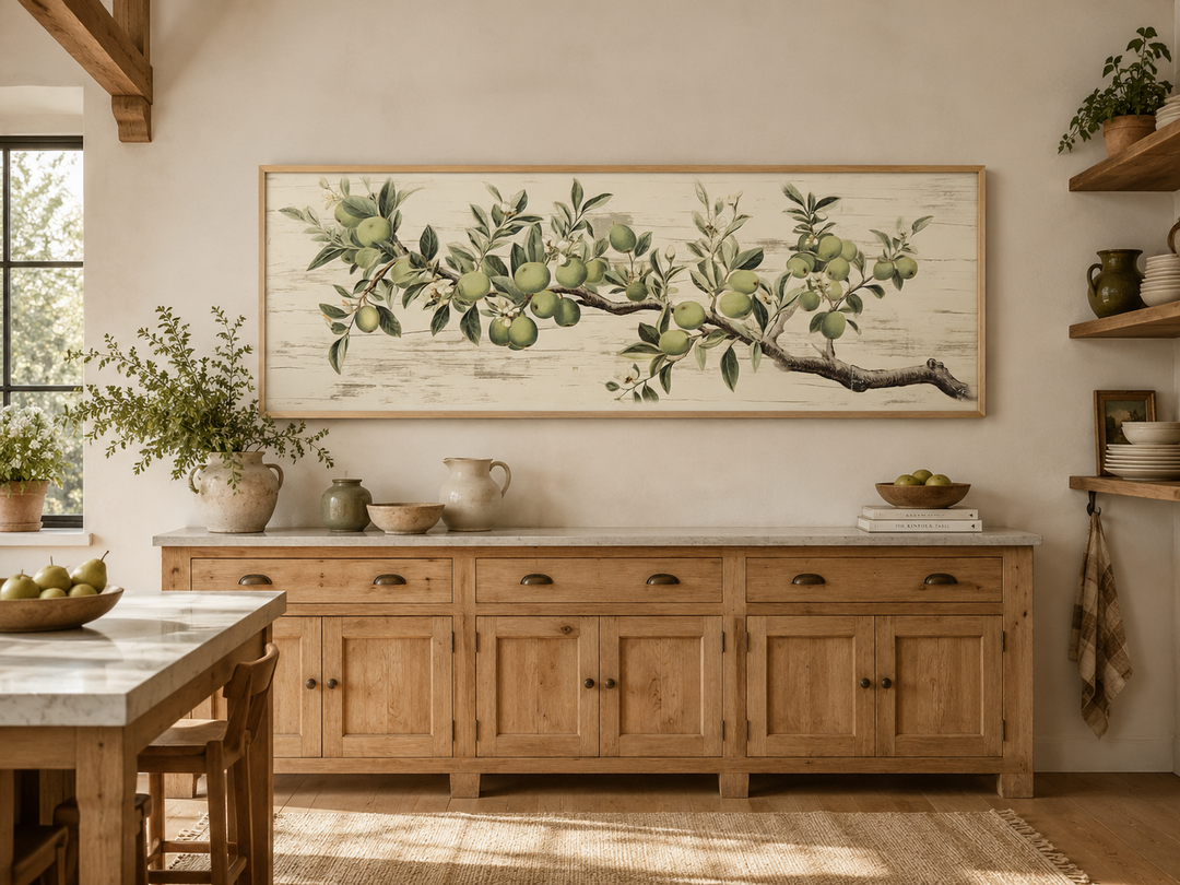 Vintage apple tree branch horizontal framed canvas wall art above a rustic wooden sideboard.