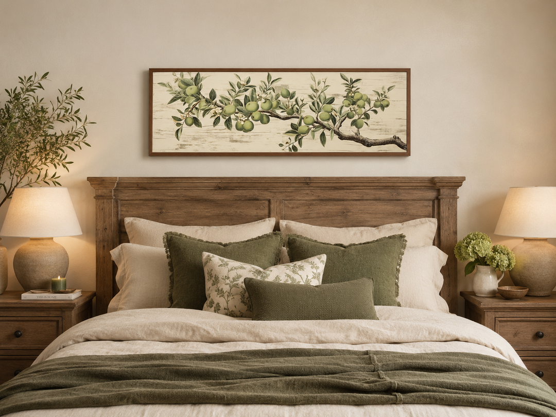 Vintage apple tree branch horizontal framed canvas wall art hanging above a bed in a bedroom.