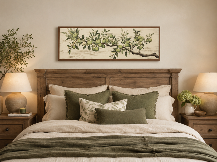 Vintage apple tree branch horizontal framed canvas wall art hanging above a bed in a bedroom.