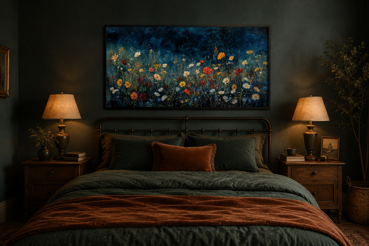 Framed canvas painting of vibrant wildflowers in a field under a dark, starry night sky.