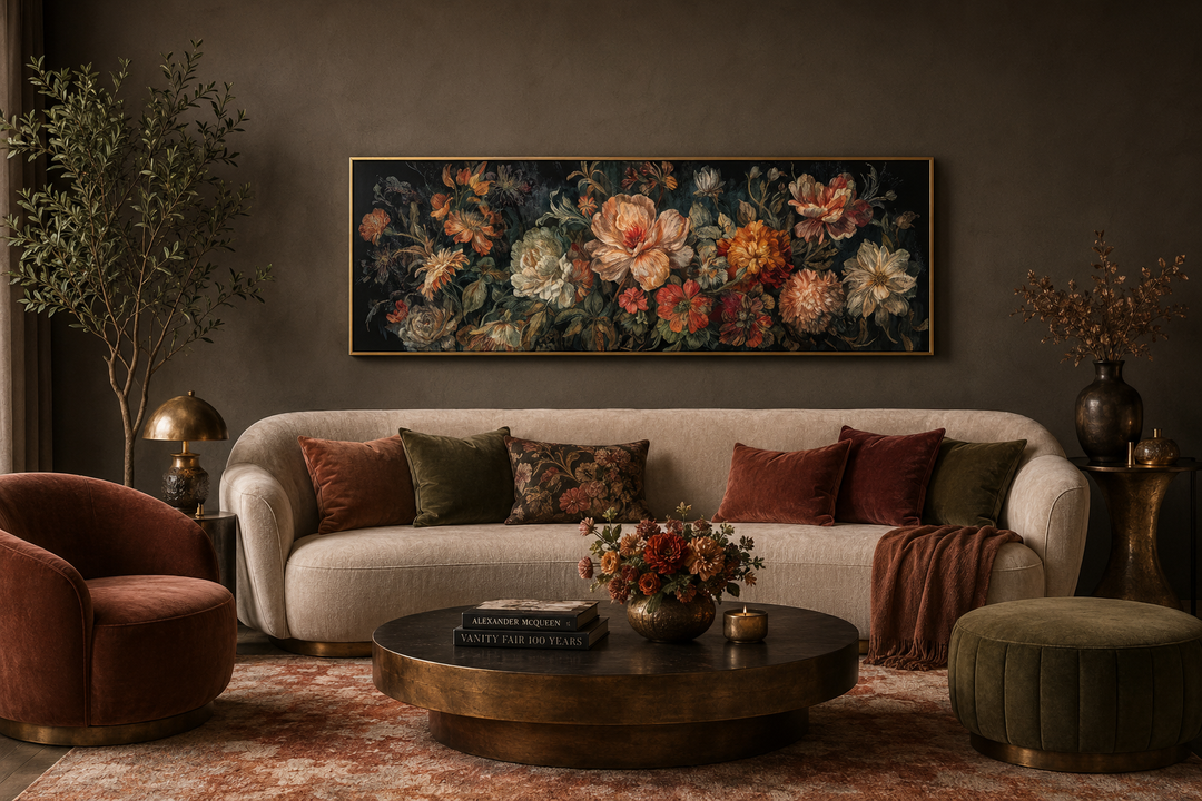 Long horizontal antique style moody floral framed canvas wall art above a beige sofa.