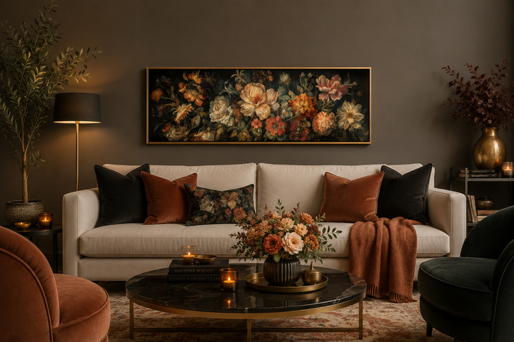 Long horizontal antique style moody floral framed canvas wall art above a cream sofa.