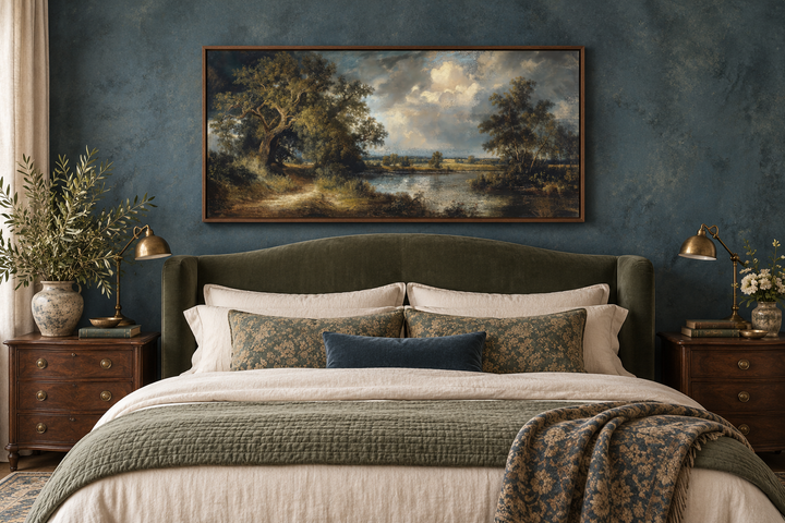 Vintage framed canvas wall art featuring a serene lake landscape with lush trees over a bed.