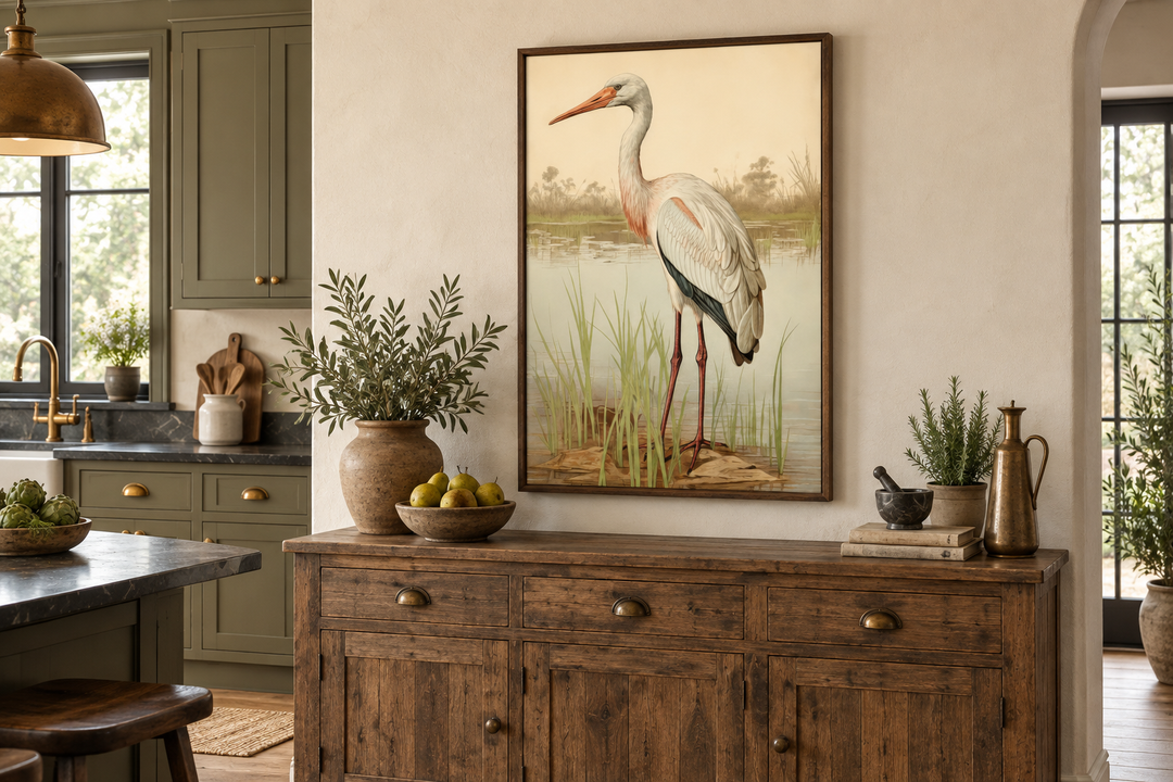 Vintage stork painting framed canvas wall art featuring a white stork in reeds above a wood buffet.