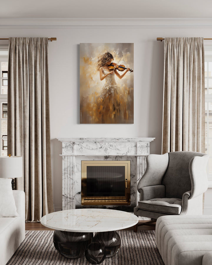 Framed canvas wall art of a violinist in a gold dress hanging above a marble fireplace.