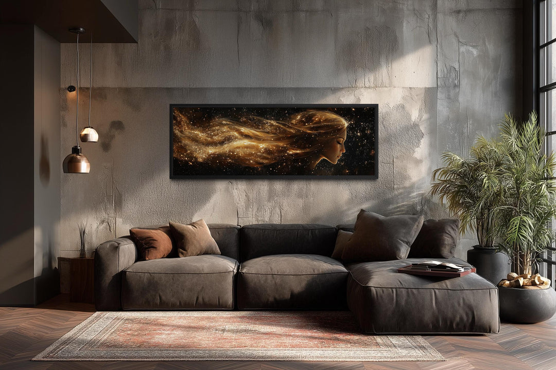 Black and gold celestial canvas art with a woman's profile.