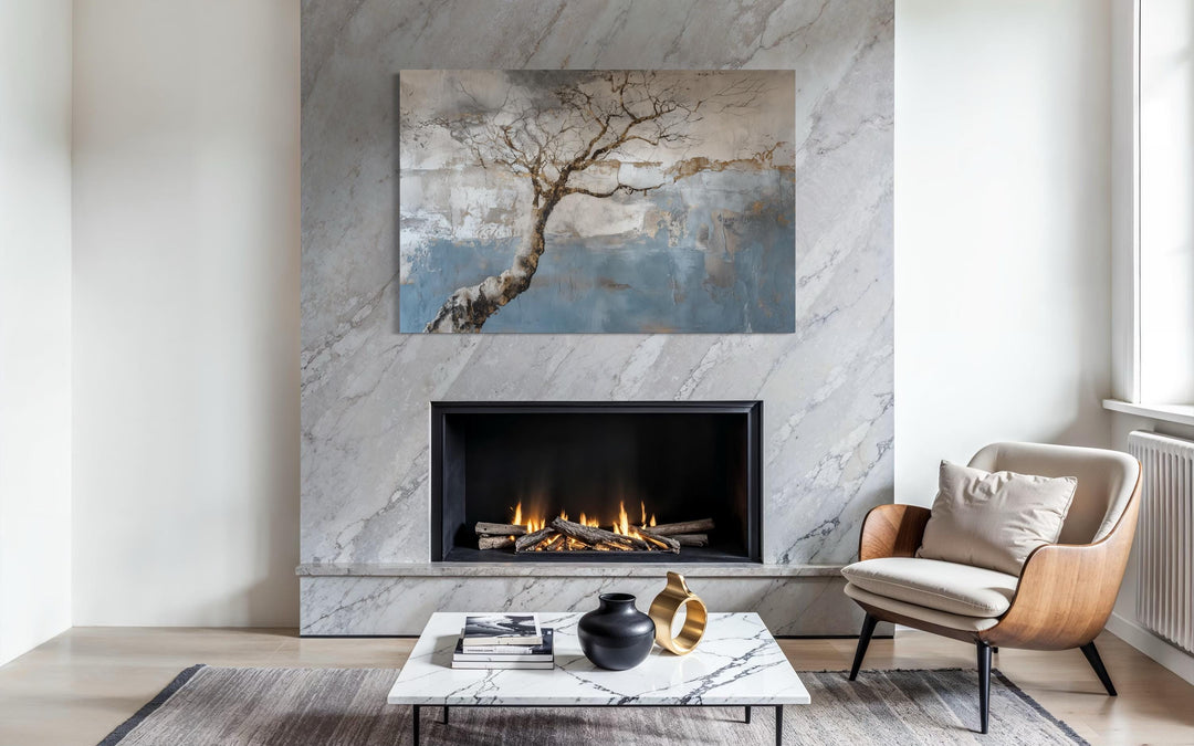 Horizontal Wabi Sabi tree landscape canvas wall art displayed above a modern marble fireplace.