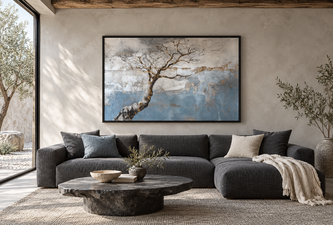 Wabi Sabi tree landscape canvas wall art in a minimalist living room above a dark grey sectional.