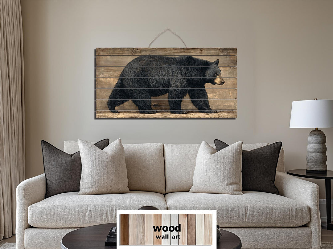 Large horizontal wood wall art featuring a walking black bear on rustic timber planks.