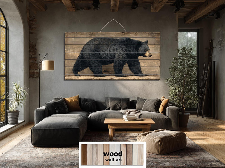 Large horizontal wood wall art featuring a walking black bear on rustic timber planks.