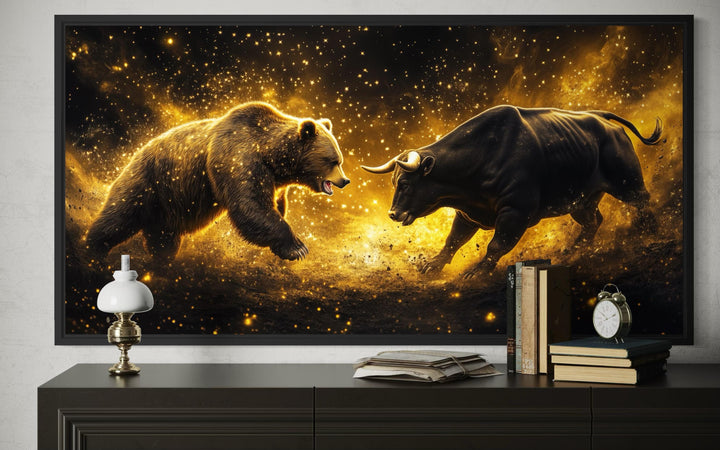 Framed canvas art of a bull and bear fighting in a gold and black celestial market cycle scene.