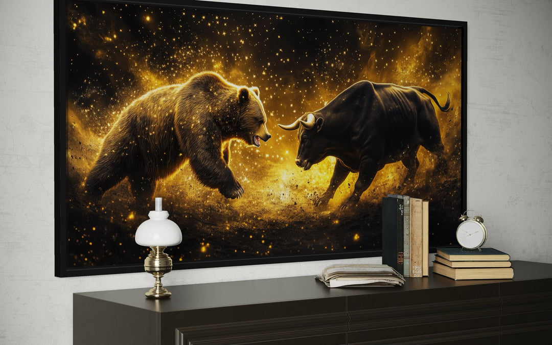A framed canvas print of a golden bull and bear fighting against a dark, starry background.