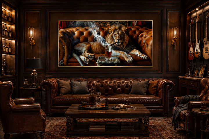 Framed canvas print of a lion smoking a cigar and drinking whiskey, hanging in a dark lounge.