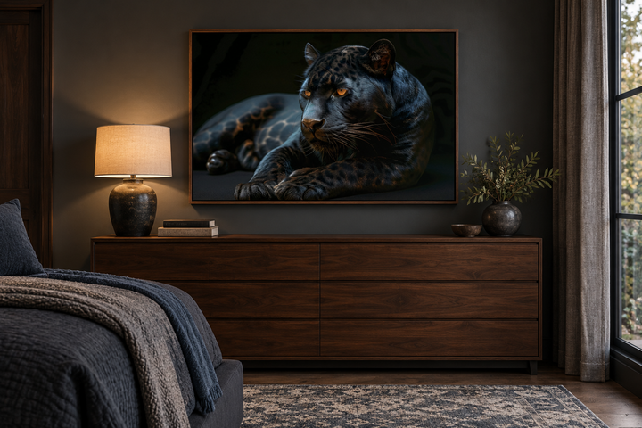 Black panther on black background framed canvas wall art hanging above a dark wood dresser.