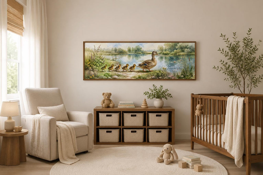 Watercolor mother duck and ducklings canvas print hanging in a neutral-toned nursery.