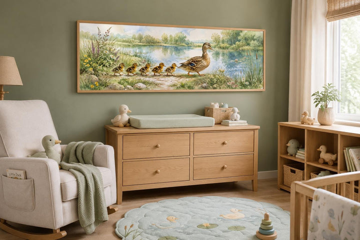 Panoramic watercolor canvas print of a mother duck and ducklings above a nursery dresser.