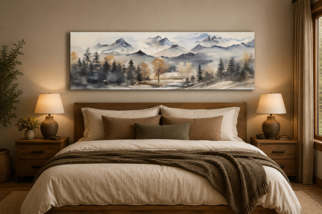 Horizontal mountain landscape canvas wall art in earth tones hanging above a bed.