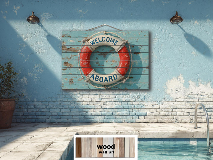 A distressed wood sign featuring a nautical lifebuoy with Welcome Aboard text on a blue wall.