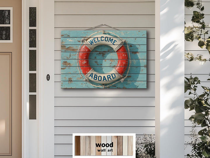 A distressed wood wall art sign featuring a nautical lifebuoy with the words Welcome Aboard.