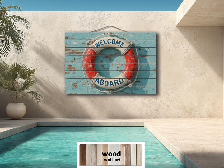 A distressed wood sign featuring a nautical lifebuoy with Welcome Aboard text hangs by a pool.