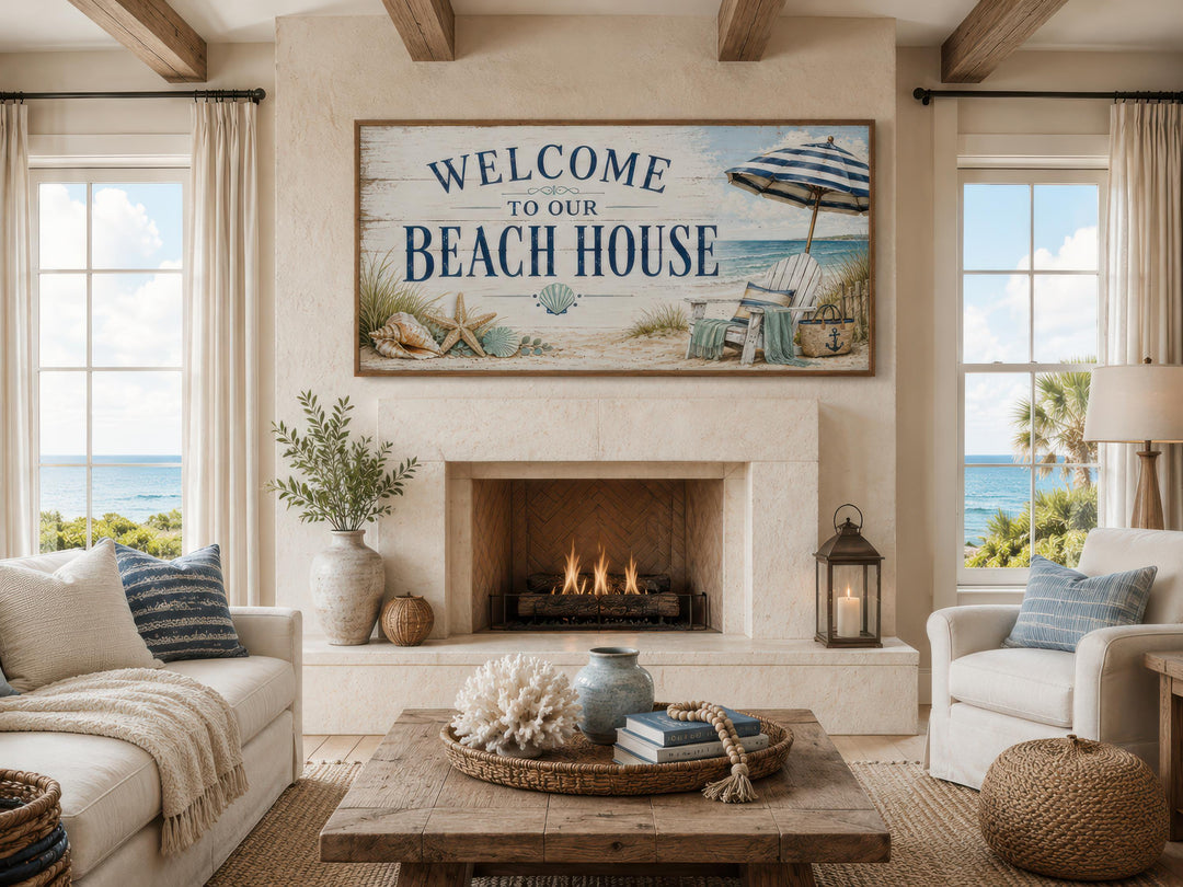 Welcome To Our Beach House rustic canvas print hanging above a fireplace in a coastal living room.