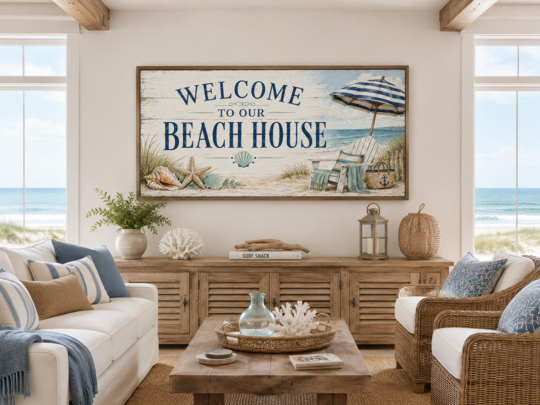 Welcome To Our Beach House rustic canvas print above a sofa in a coastal-themed living room.