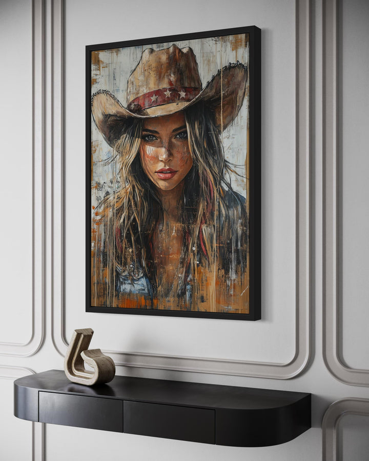 Western cowgirl rustic framed canvas wall art featuring a woman in a cowboy hat on a textured wall.