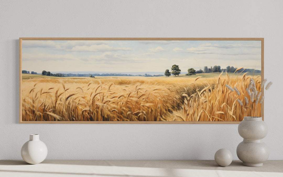 Long horizontal framed canvas wall art of a golden wheat field landscape for farmhouse decor.