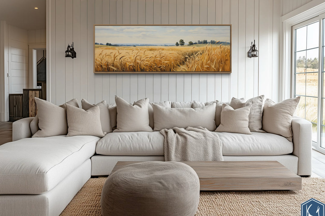 Wheat field farm landscape long horizontal framed canvas wall art above a sofa in a farmhouse room.