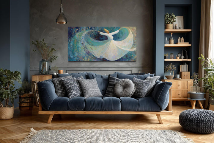 Large horizontal canvas art of a whirling dervish in white over a teal blue living room sofa.