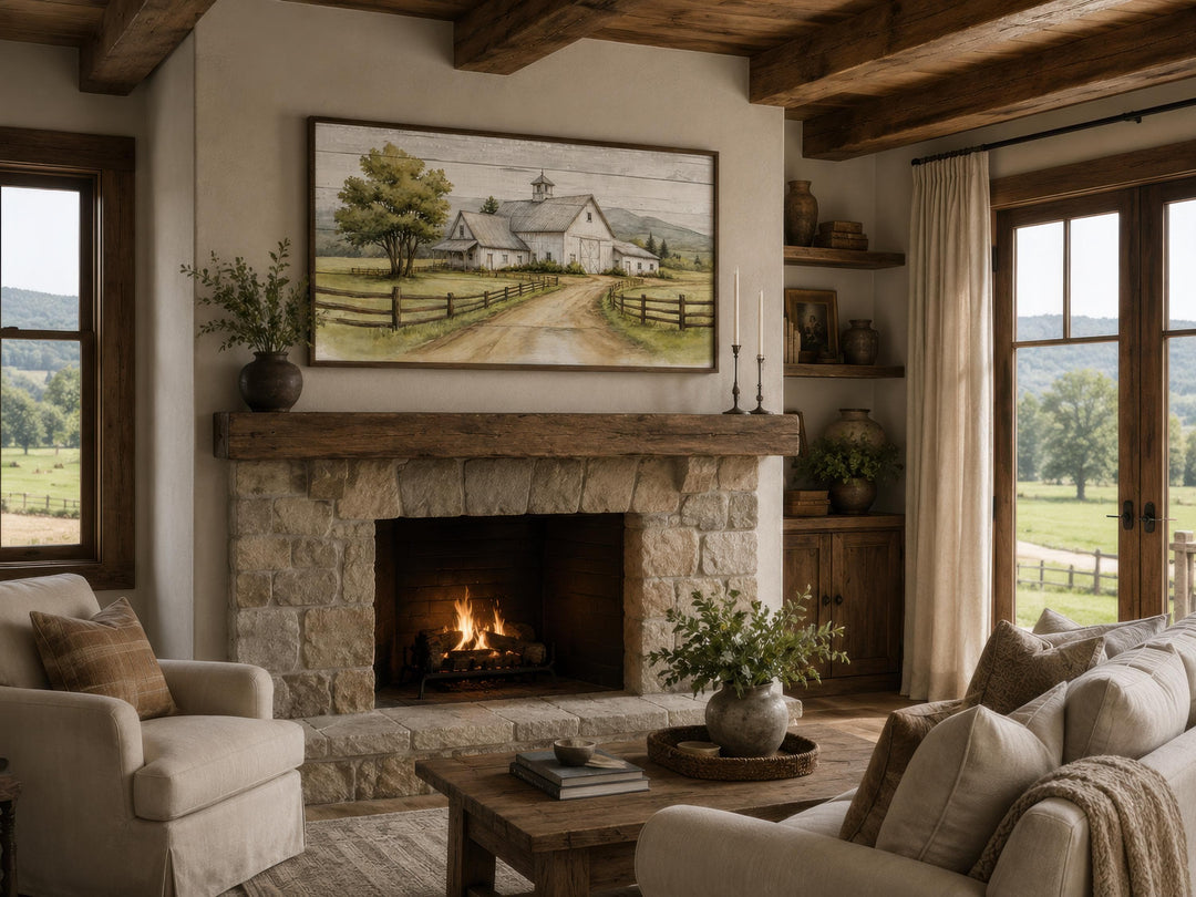White barn wall art in a rustic farmhouse living room above a stone fireplace with a warm fire.