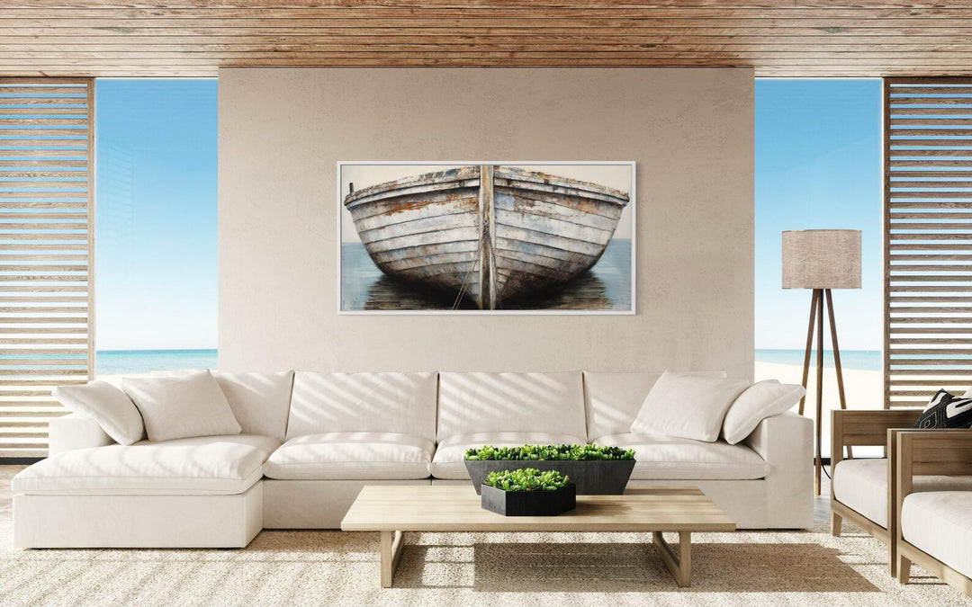 Rustic old boat close-up framed canvas wall art displayed in a coastal-style living room.