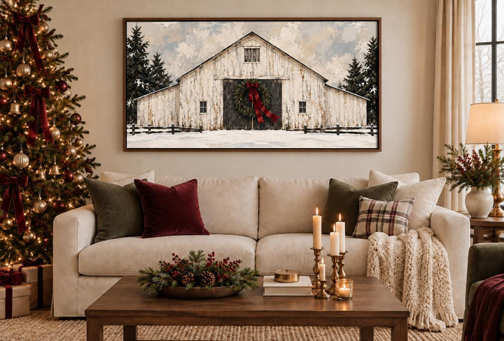 White Christmas Barn framed canvas wall art above a sofa in a festive living room.