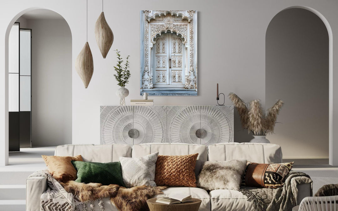 White and grey Indian door framed canvas wall art hanging above a sideboard in a living room.