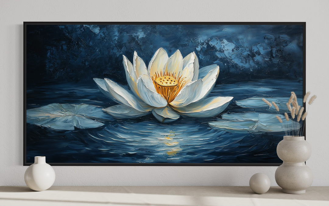 White lotus flower wall art on a navy blue background.