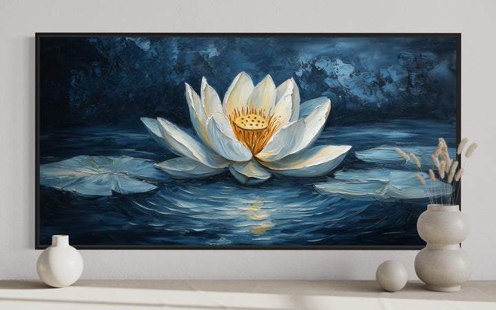 White lotus flower wall art on a navy blue background.