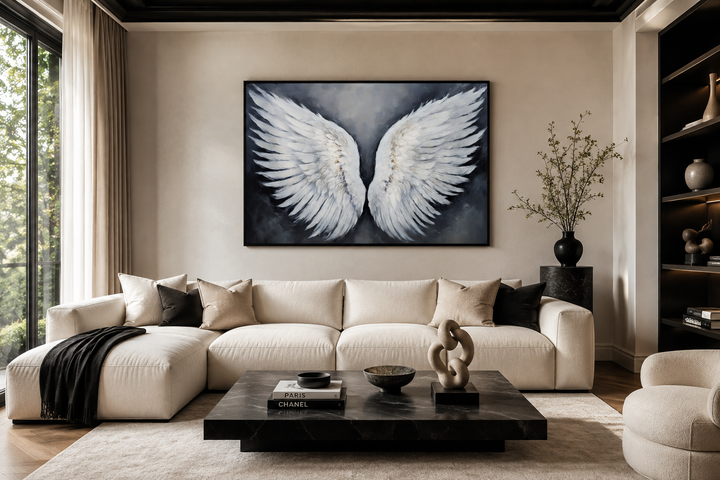 Large horizontal canvas art featuring detailed white angel wings on a dark grey background.