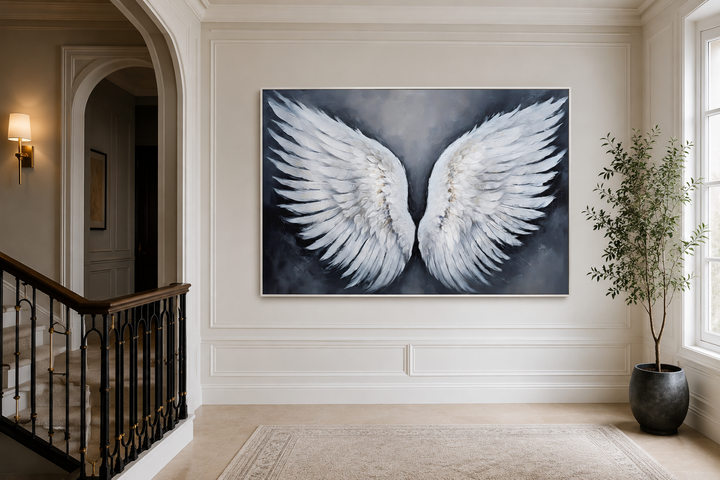 Large canvas wall art of white angel wings on a grey background in a modern hallway.