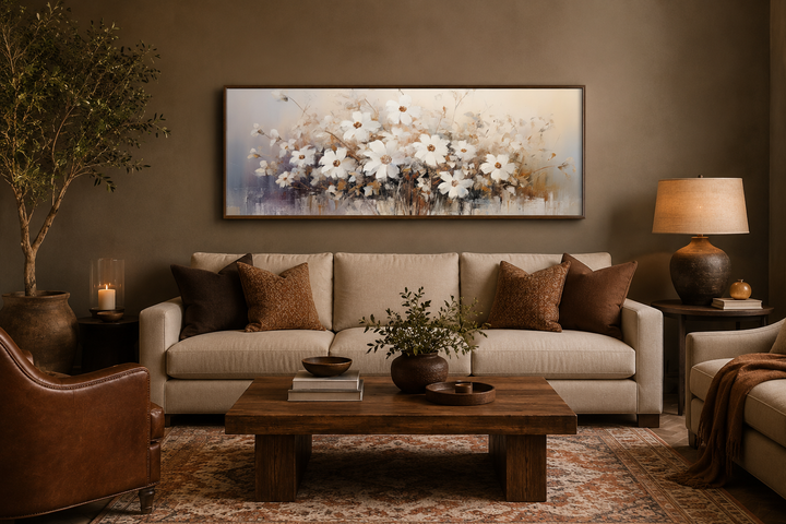 White and beige neutral wildflowers farmhouse framed canvas wall art above a beige sofa.