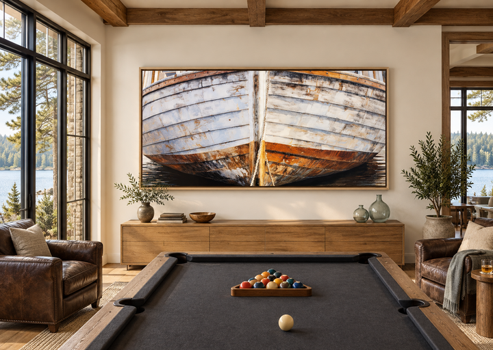 Rustic white and brown old wooden boat canvas art hanging above a sideboard in a lake house room.