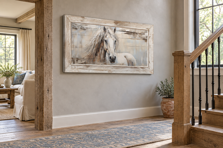 Rustic white horse painting on distressed wood framed canvas in a farmhouse hallway.