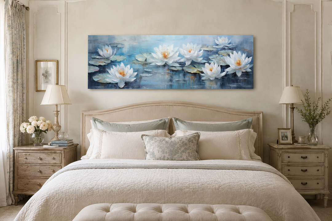 Horizontal canvas wall art of white lotus flowers on a blue pond, hanging above a bed.