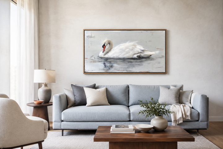 Framed white swan canvas painting hanging above a light blue sofa in a rustic farmhouse living room.