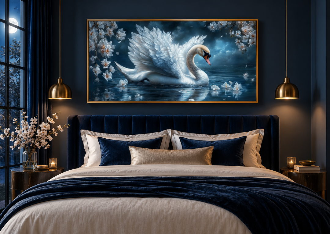 White swan canvas print above a navy blue bed with gold accents and moonlit window view.