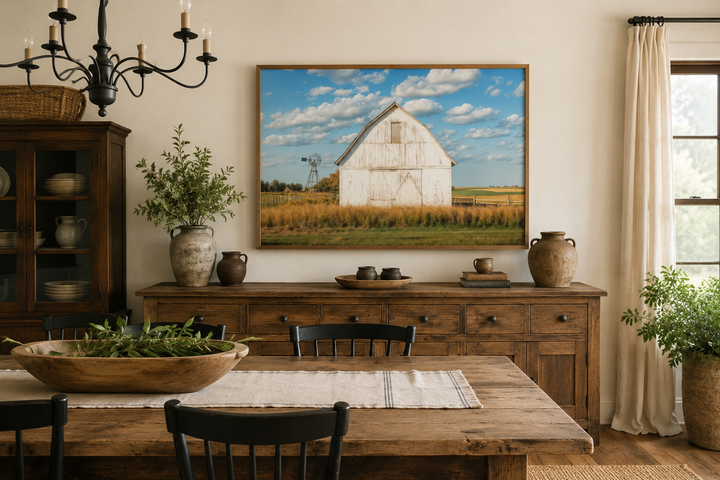 Old weathered white barn with windmill framed canvas wall art in a rustic farmhouse dining room.