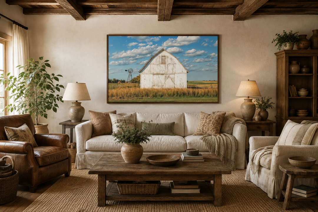 Old weathered white barn with windmill framed canvas wall art in a rustic farmhouse living room.