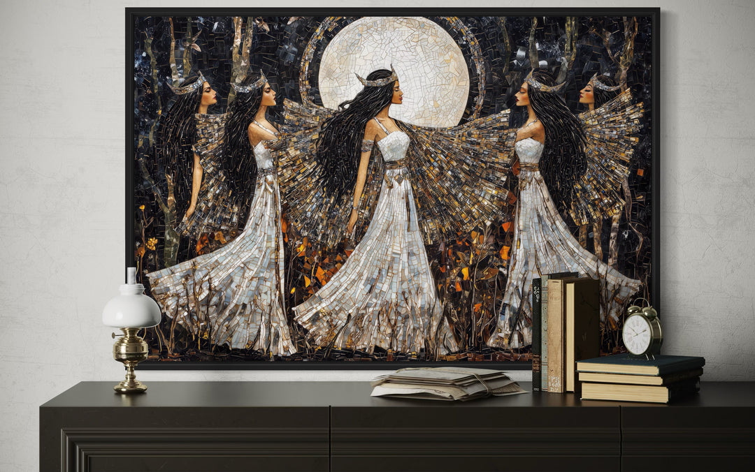 Framed mosaic-style canvas art of five goddesses in white robes dancing under a full moon.