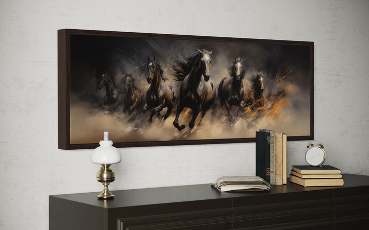 Long horizontal canvas wall art of wild brown galloping horses in a dark, moody landscape.