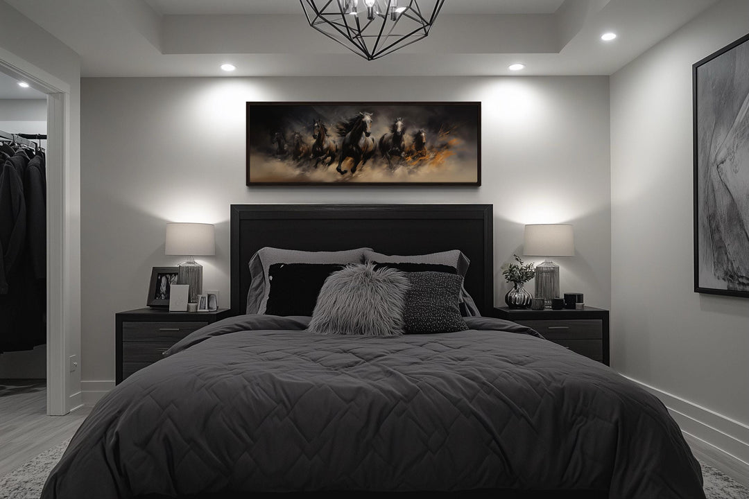 Wild brown galloping horses long horizontal canvas wall art hanging above a dark modern bed.