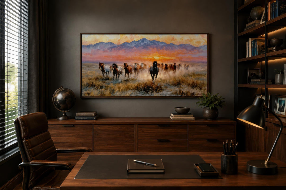 Wild Mustang wall art featuring running horses on canvas in a dark, modern office setting.